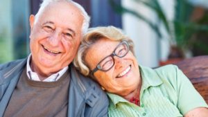 Happy aged people with good auto insurance for less